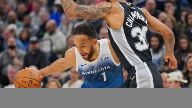 Minnesota Timberwolves forward Kyle Anderson (1) dribbles against the San Antonio Spurs forward Julian Champagnie (30) in the first quarter at Target Center in Minneapolis on Feb. 27, 2024.